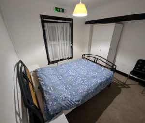 Double bed with bedside drawers